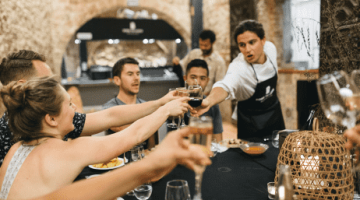 Guests toast at their private dinner